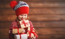 happy child girl with Christmas present