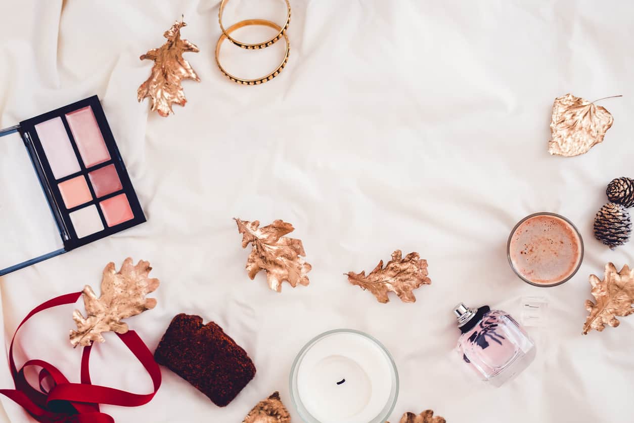 Fall beauty products from above on white